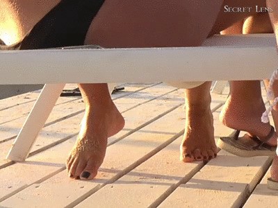 Naked Feet And Black Toenails On The Beach